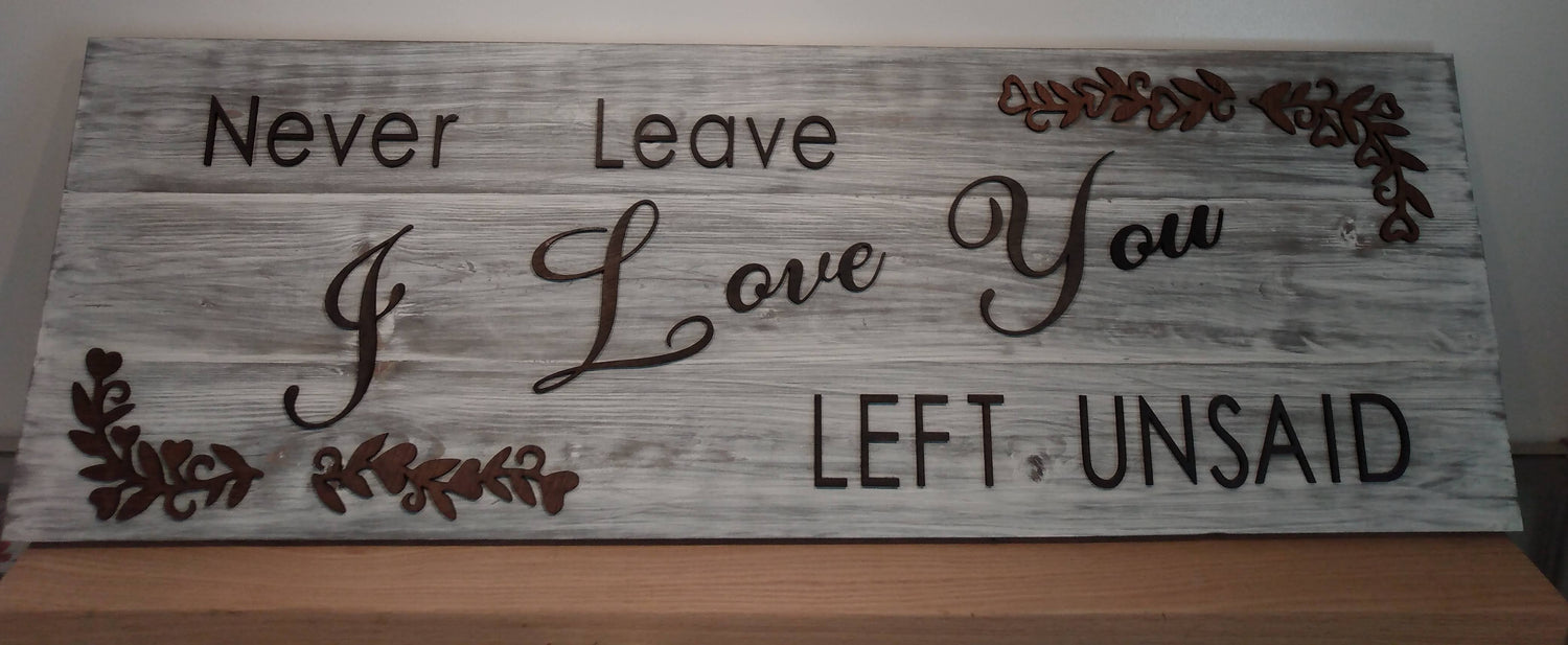 Stacked wooden sign "Never leave I love you Left unsaid"